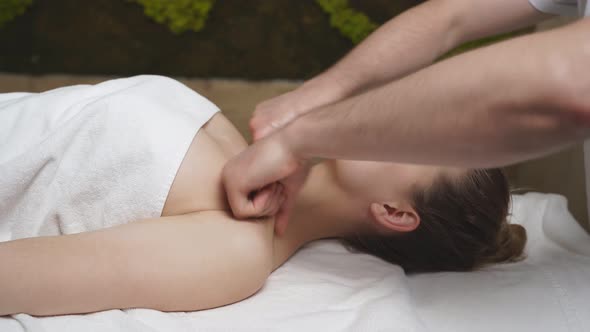 Young Lady Relax During Spa Massage In Beauty Center