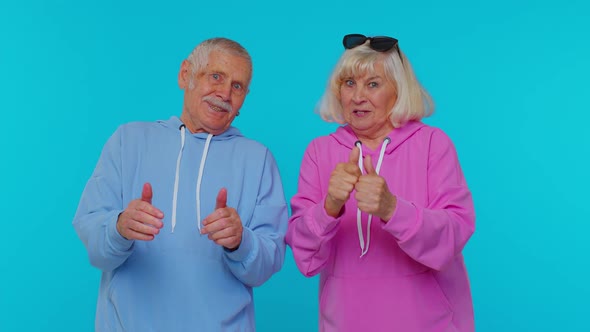 Senior Stylish Grandparents Pensioners Showing Thumbs Up Nodding in Approval Successful Good Work