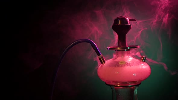 Purple Hookah Smoke on a Black Background. Slow Motion