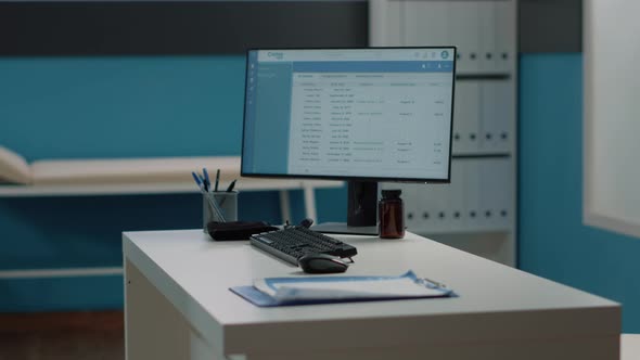 Close Up of Desk with Computer and Medical Instruments