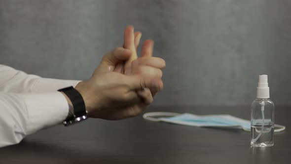 Man Using Bottle of Liquid Alcohol Spray Sanitizer with Hands. Coronavirus