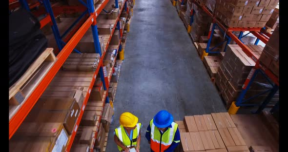 Warehouse worker working and interacting with each other