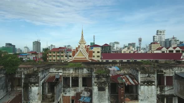 Aerial view above of a abandoned building near a temple, Cambodia.