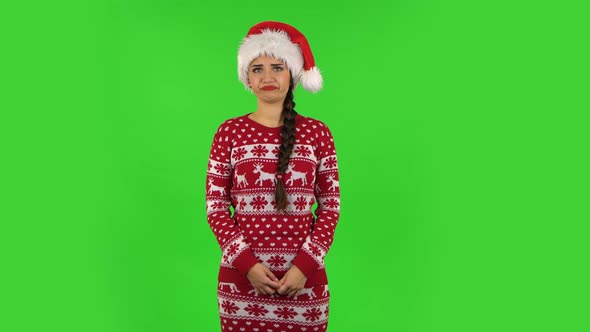 Sweety Girl in Santa Claus Hat Is Frustrated Saying Wow. Green Screen