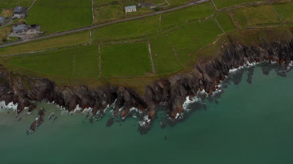 High Angle View of Waves Crashing on Rugged Rocky Sea Coast