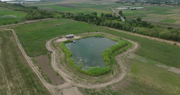 lake in shape of heart with gazebo , aerial orbit shot