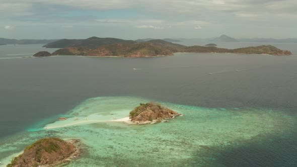 Small Torpic Island with a White Sandy Beach, Top View.