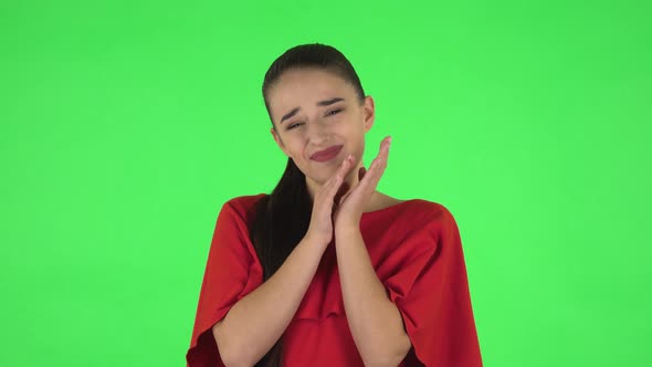 Portrait of Pretty Young Woman with Surprised Wow Face Expression and Tender Smiling. Green Screen