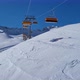 Ski lift in a ski resort in the german alps. Skiers on a ski slope on a sunny winter day. - VideoHive Item for Sale
