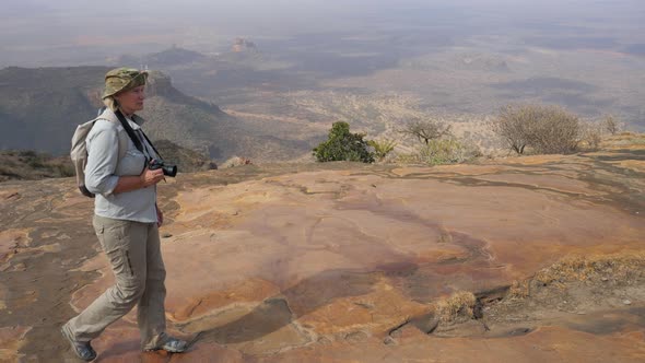 Tourist Photographer Walks On Top Of A Volcano With Beautiful View Of The Valley