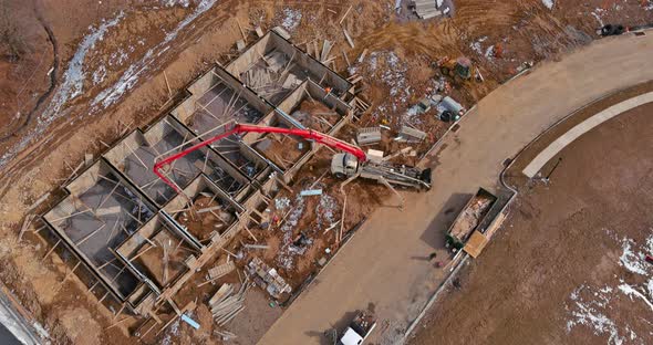 Construction the Foundation Walls of Building with Concrete Supply for Pouring Using a Concrete Pump