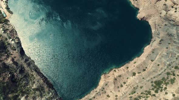 Aerial View of Wind Gusts on the Surface of a Waterfilled Quarry