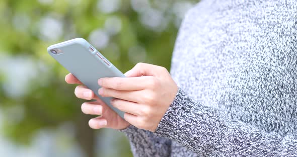 Woman hold with cellphone at outdoor