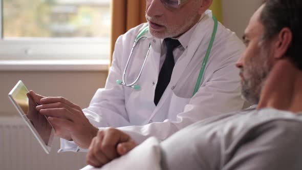 Elderly Physician and Patient Watching Brain Scans