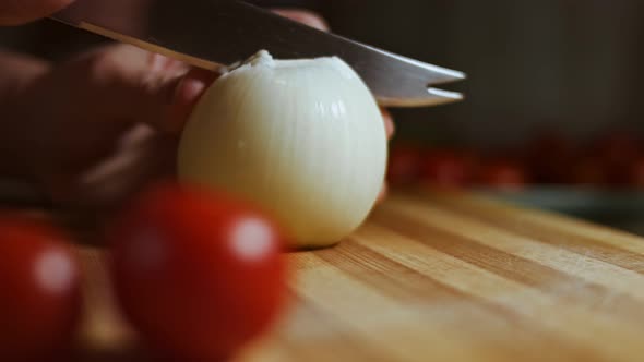 Chopping Onions Chef on a Wooden Board