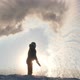Silhouette of a Man Pouring Boiling Water in the Cold. Experiment with Hot Water. - VideoHive Item for Sale