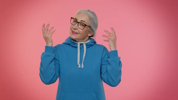 Mature Old Grandma Woman Making Playful Silly Face Expressions Grimacing Fooling Showing Tongue