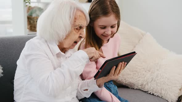 Granddaughter and Grandmother with Tablet