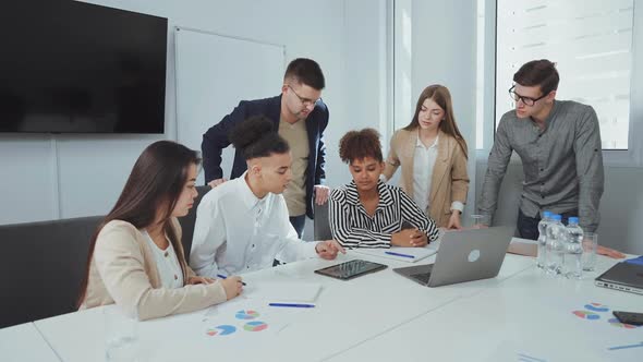 Black Man Presenting New Project at Business Meeting