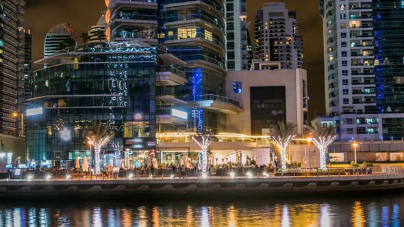 View of Dubai Marina Towers and Canal in Dubai Night Timelapse