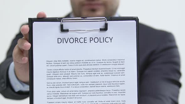 Lawyer Showing Divorce Policy at Camera, Child Custody Agreement, Property