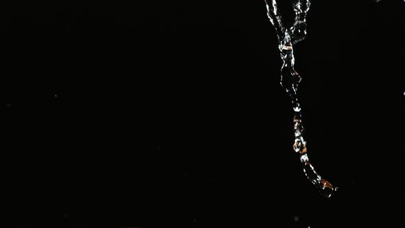 Water pouring and splashing in ultra slow motion 