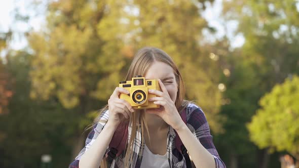 Young Happy Woman Taking Pictures on The Camera