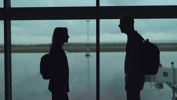 A Couple at the Airport Waiting for a Flight