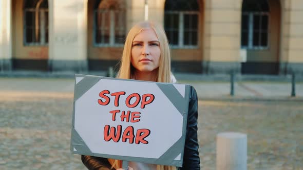 Young Woman Calling to Stop the War By Holding Steamer