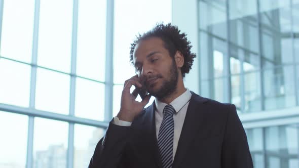 Middle Eastern Businessman Calling on Mobile Phone