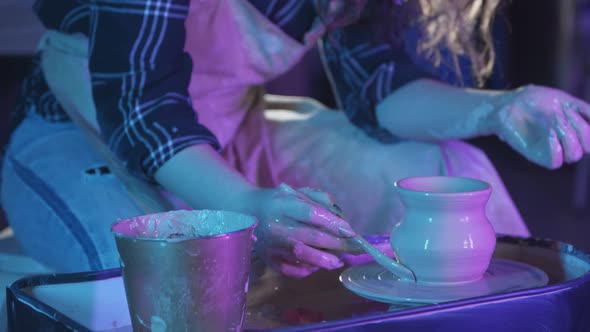 Pottery Crafting in the Art Studio Woman Forming a Simple Pot Out of Clay and Removing Excess From