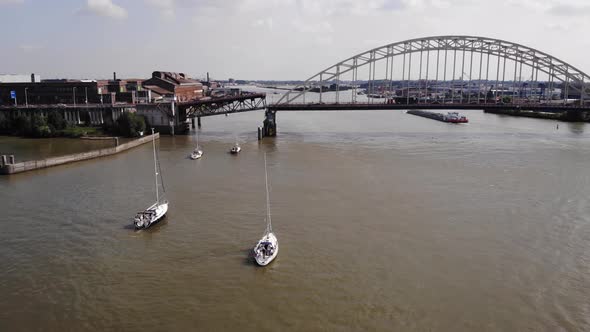 Sailboats At Noord River Waiting For Bascule Bridge To Open In Alblasserdam, South Holland, Netherla