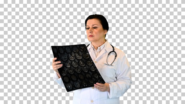 Senior female radiologist examining brain scan mri, Alpha Channel