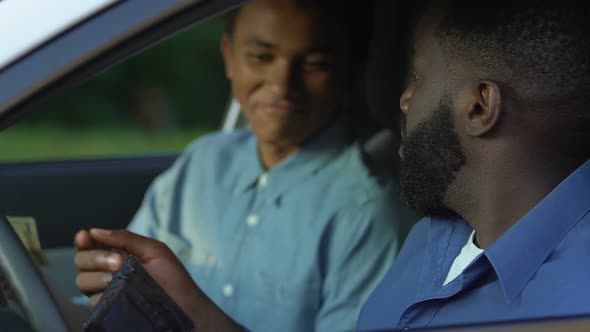 Afro-American Dad Giving Grateful Teenage Son Pocket Money, Trustful Relations