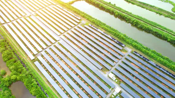 Drone fly over solar farm, renewable energy from solar.