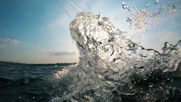 A Person Is Kiteboarding with Splashes