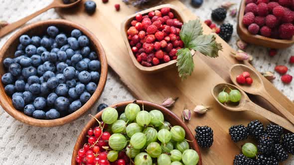 Ripe And Sweet Berries In Bowl On Wooden Table. Healthy Eating.