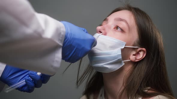 PCR Test Process Doctor Medical Staff Worker Wearing Protective Equipment Takes Sample From Nose of