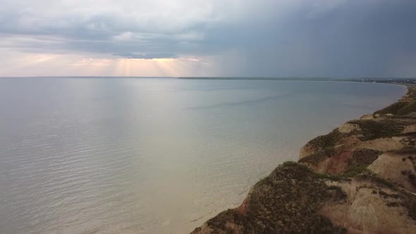 Rays of the Setting Sun Over a Wide River