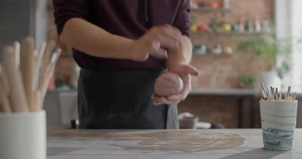 Ceramist Kneads a Colored Piece of Clay to Make a Narikomi Pottery at the Workshop Potter at Work