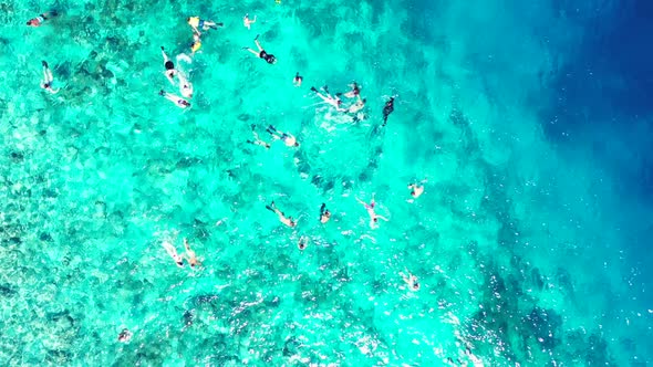 Aerial panorama of perfect tourist beach trip by blue lagoon and white sand background of journey ne