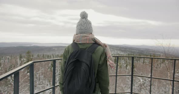 Female Tourist Enjoying Amazing Winter Landscape From Observation Point in Mountain Forest