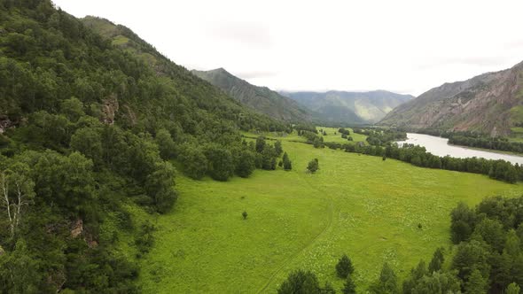 Green Grassy Fields Along the Mountainous Region