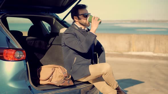 Businessman In Sunglasses. Man Drink Coffee And Relaxing After Work.  Italian Man Looking At River.