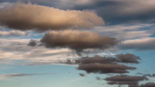 Timelapse of clouds moving in different directions alt