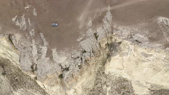 Off Road Car Driving on Dirty Road in Mountain Terrain