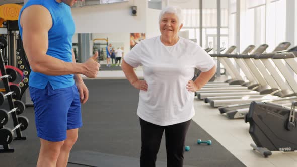 Pensioner Elderly Woman in a Gym on Step Platform