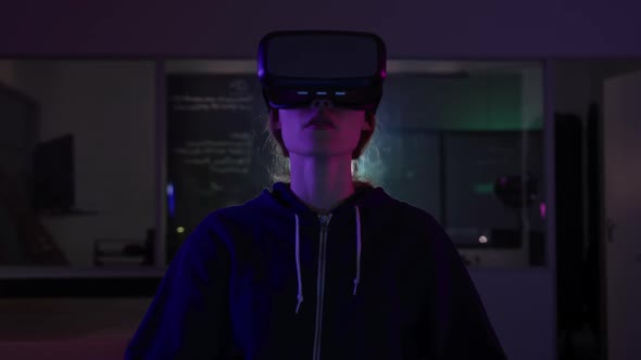 Caucasian woman wearing VR headset in creative office