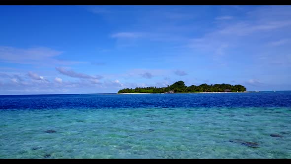 Aerial flying over travel of idyllic lagoon beach voyage by aqua blue ocean with clean sandy backgro