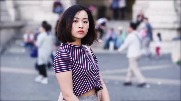 portrait of Serious asian woman looks menacingly at the camera